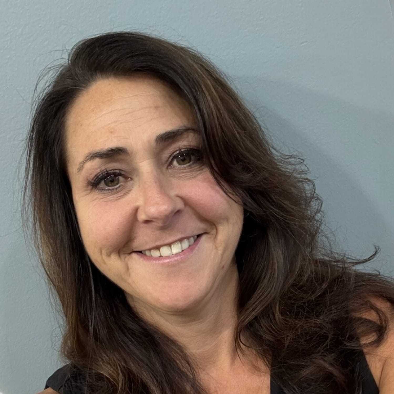 Portrait of Shannon, a professional stylist at Somerby's Hair Salon, showcasing their expertise and style.