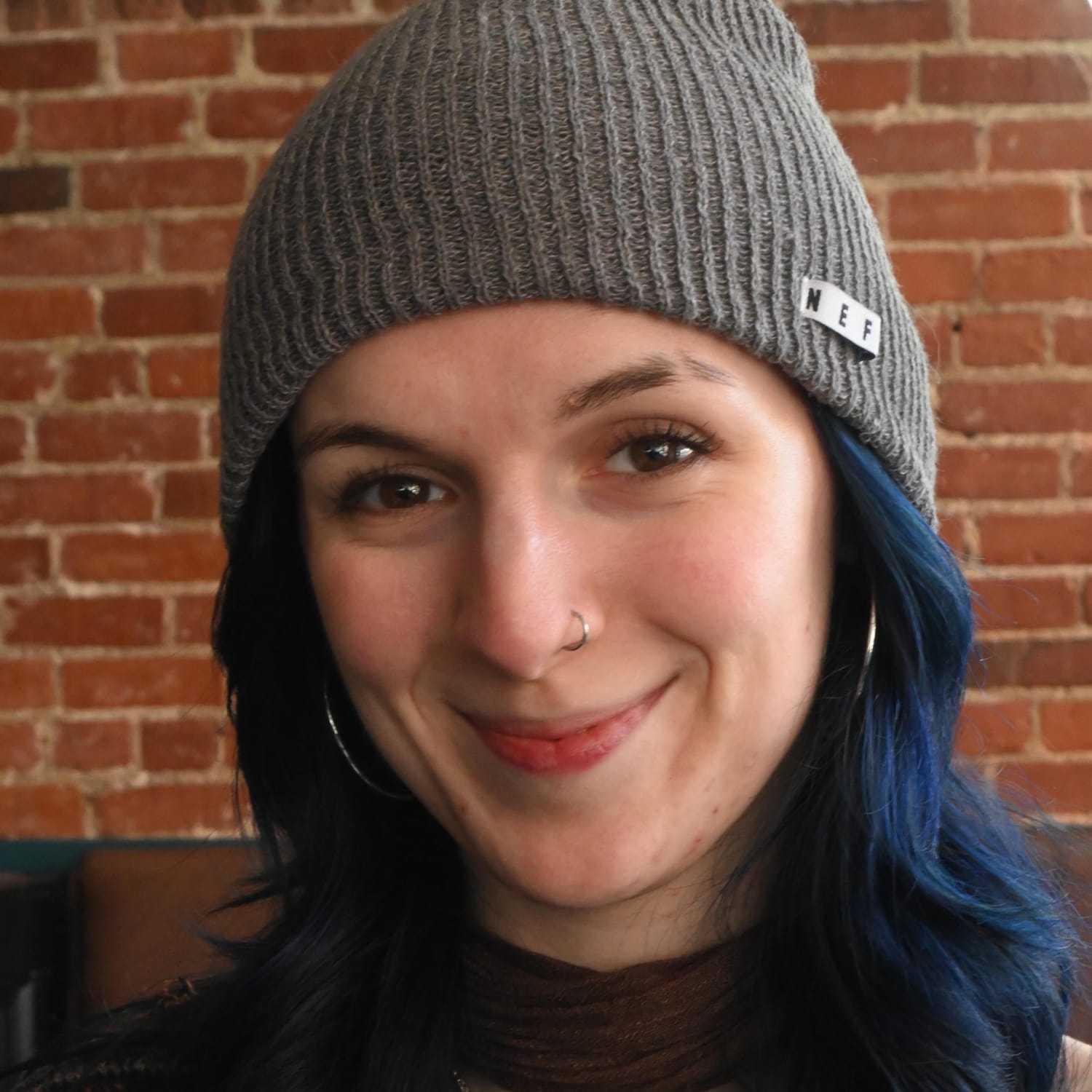 Portrait of Madilin, a professional stylist at Somerby's Hair Salon, showcasing their expertise and style.