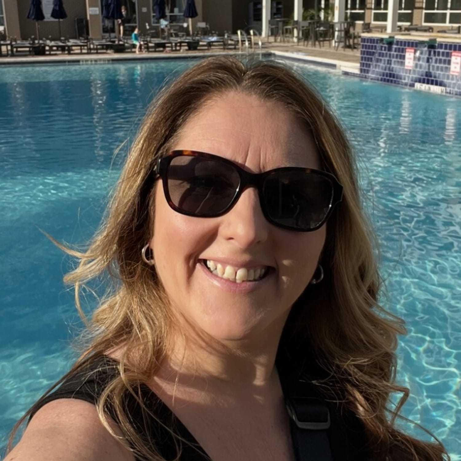 Portrait of Jen, a professional stylist at Somerby's Hair Salon, showcasing their expertise and style.