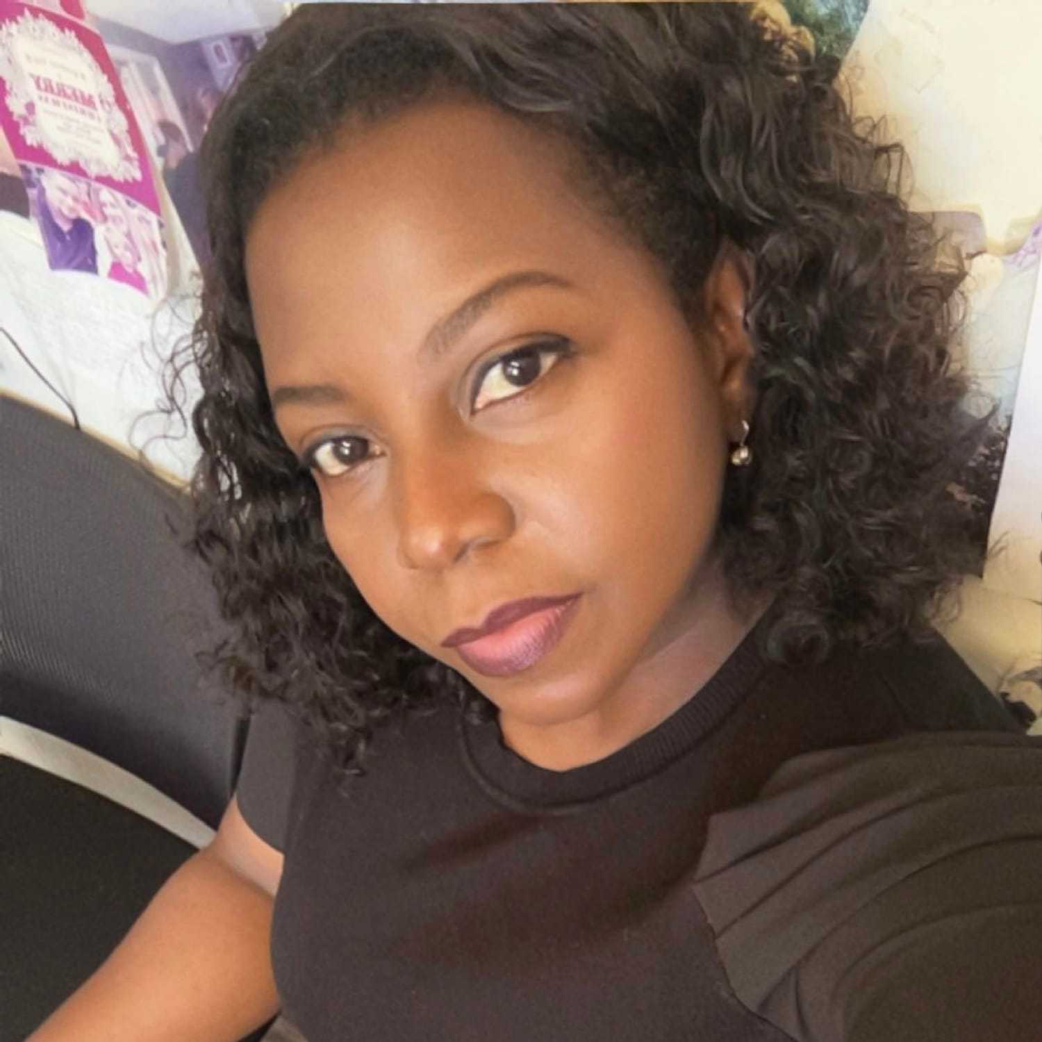 Portrait of Wiline, a professional stylist at Somerby's Hair Salon, showcasing their expertise and style.