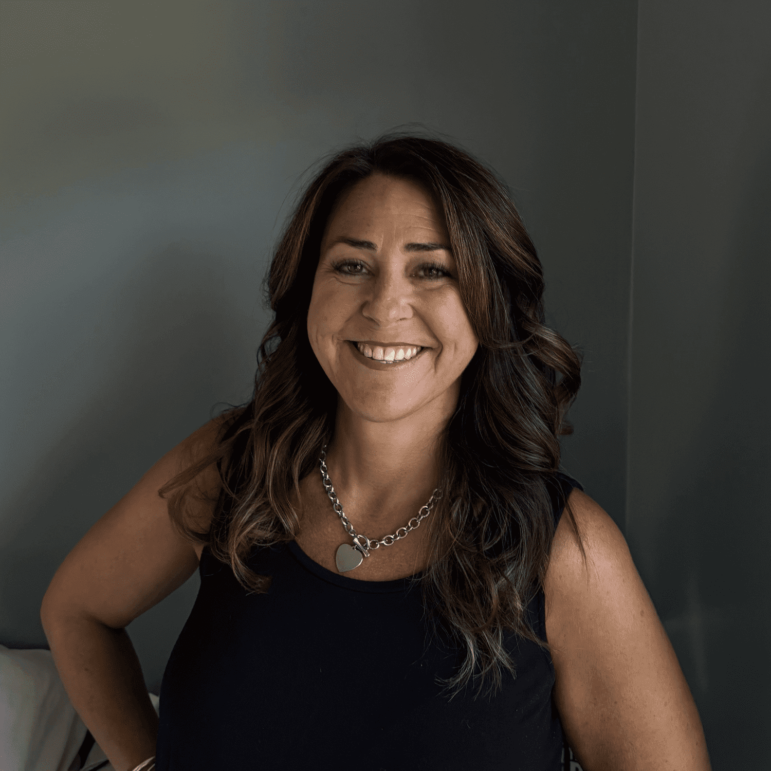 Portrait of Shannon, a professional stylist at Somerby's Hair Salon, showcasing their expertise and style.