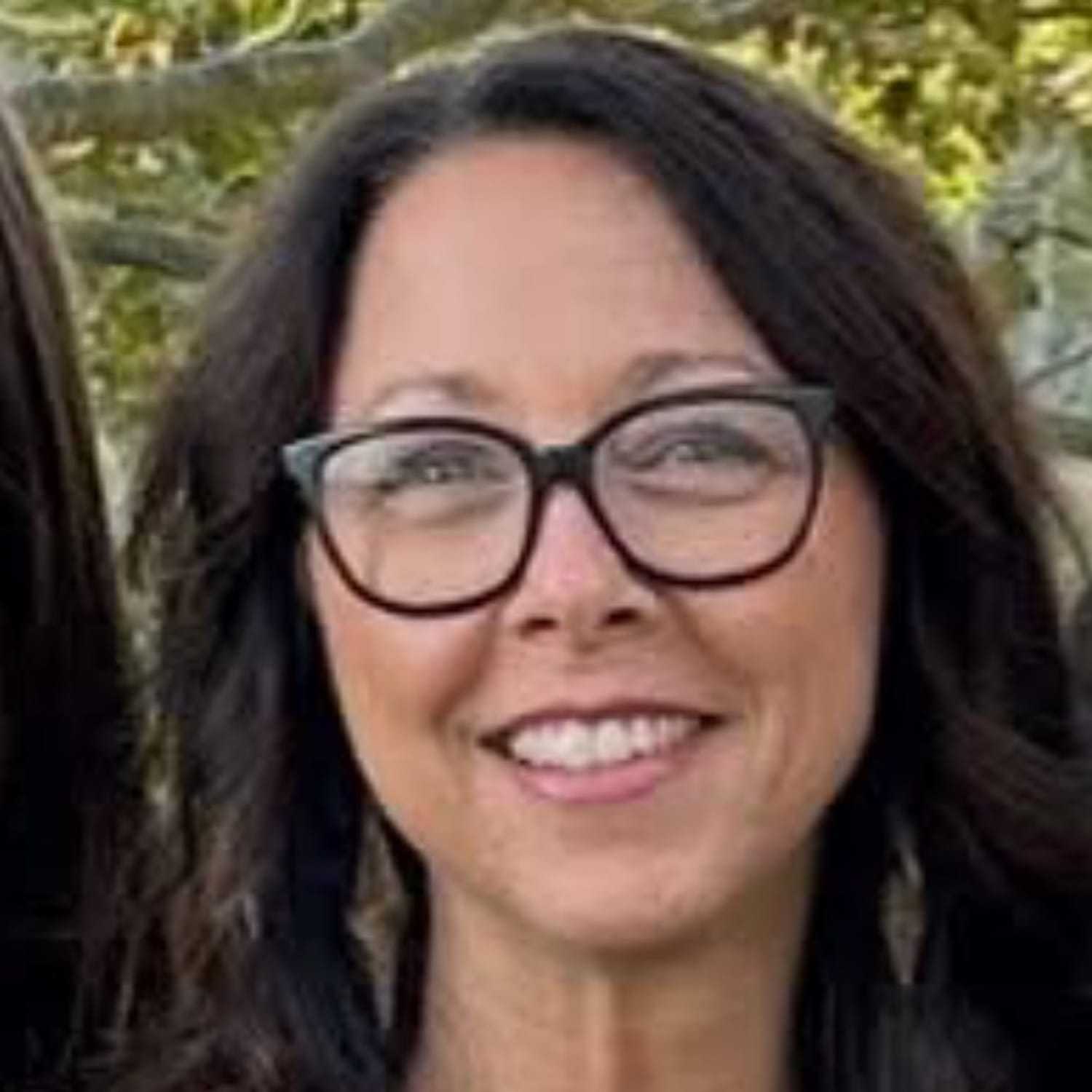 Portrait of Michelle, a professional stylist at Somerby's Hair Salon, showcasing their expertise and style.